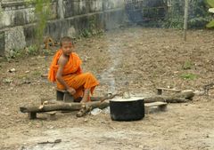 Child Monk heating water
