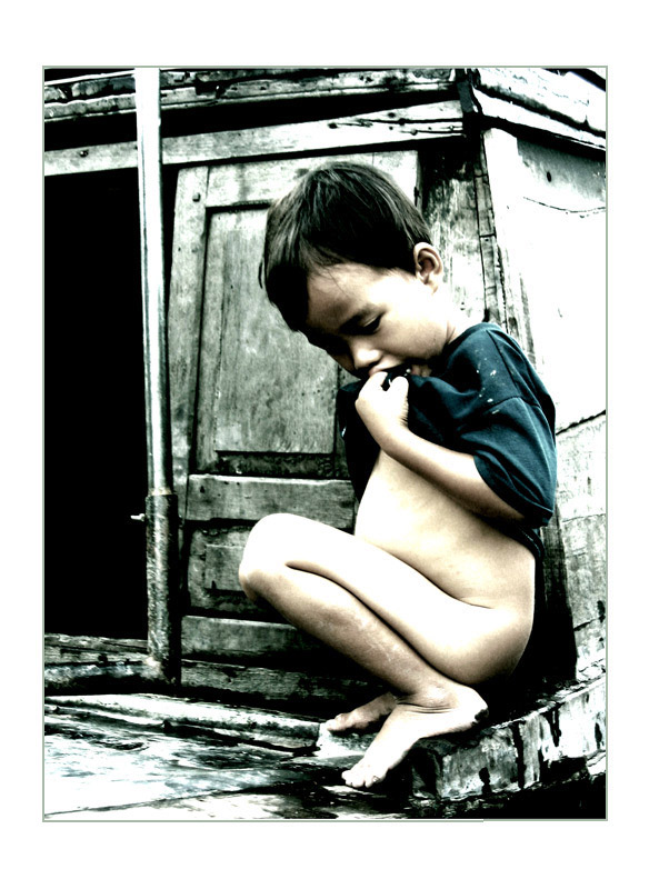 Child on the old boat