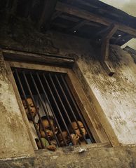 children behind window