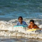 Children happiness in the waves