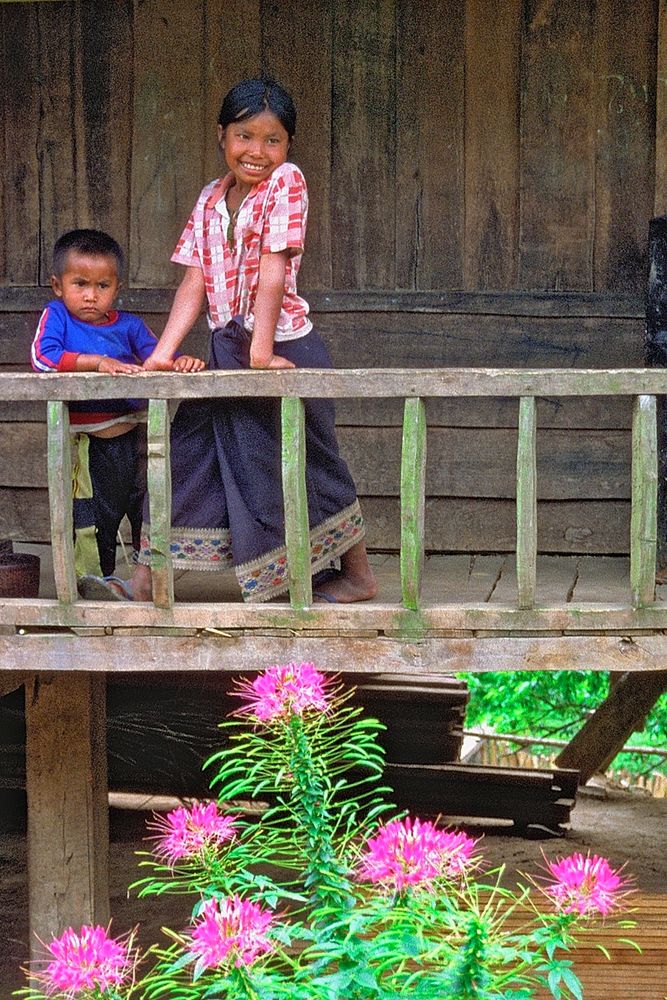 Children on the balcony in Vieng Xai