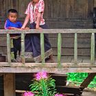 Children on the balcony in Vieng Xai