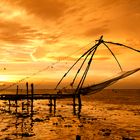 chinese fishing net at sunset