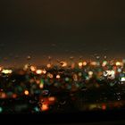 City lights behind the raindrops