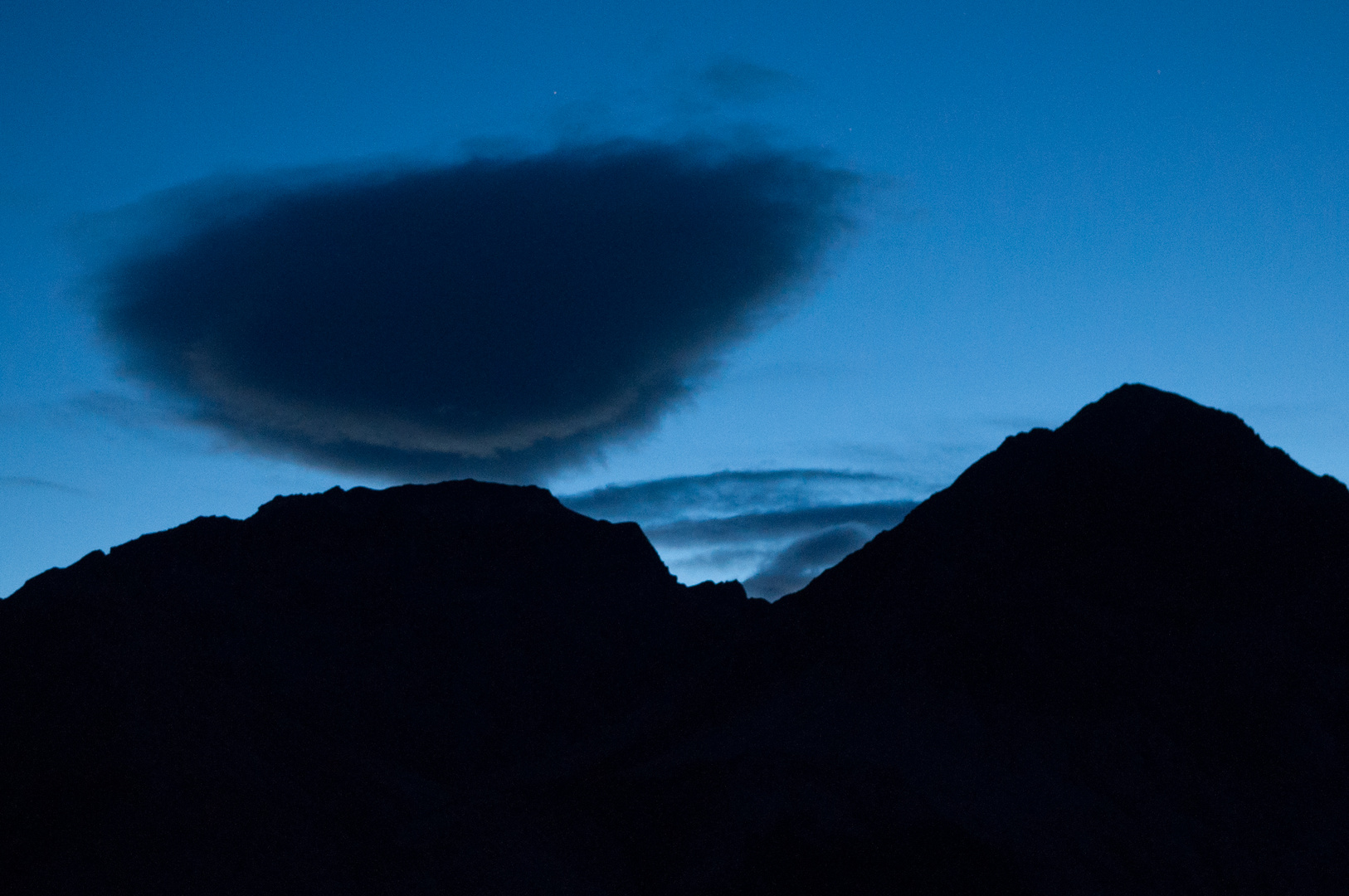 Cloud over mountain before sunrise