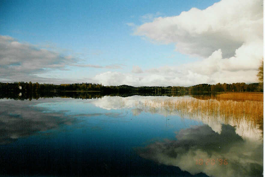 clouds above a swedish lake by Fosserum