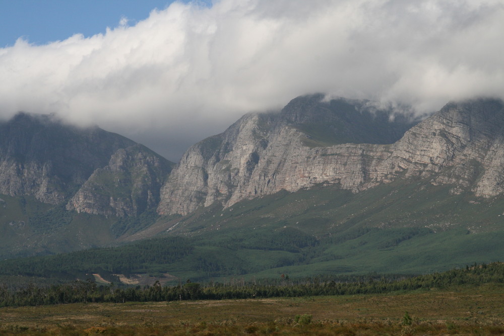 clouds are climbing through the hills