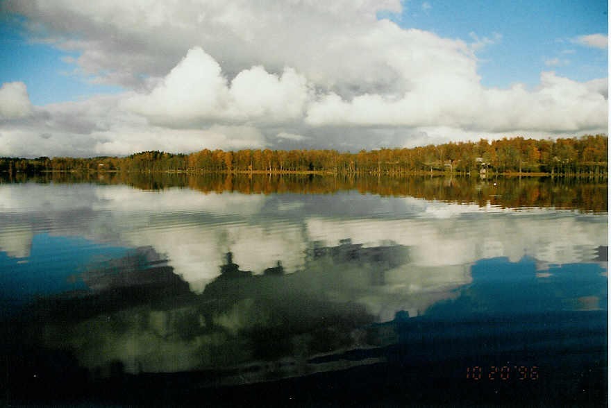 clouds in mirror of the lake in sweden 1996 by Fosserum