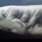 Clouds stream into the valley and collapse