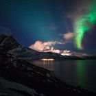 Colorful northern lights over the Ocean.