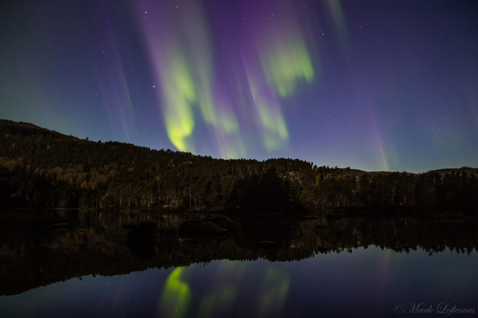 Colorful northern lights reflection