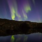 Colorful northern lights reflection