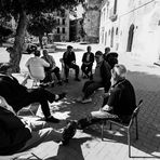 Conversation in the sunny square