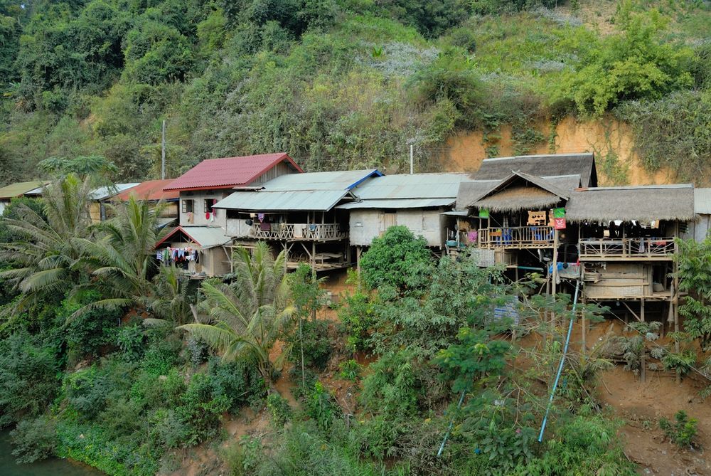 Cottages built on escarpment in Sin Xai village