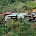 Cottages built on escarpment in Sin Xai village