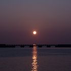 couché de soleil sur port en bessin