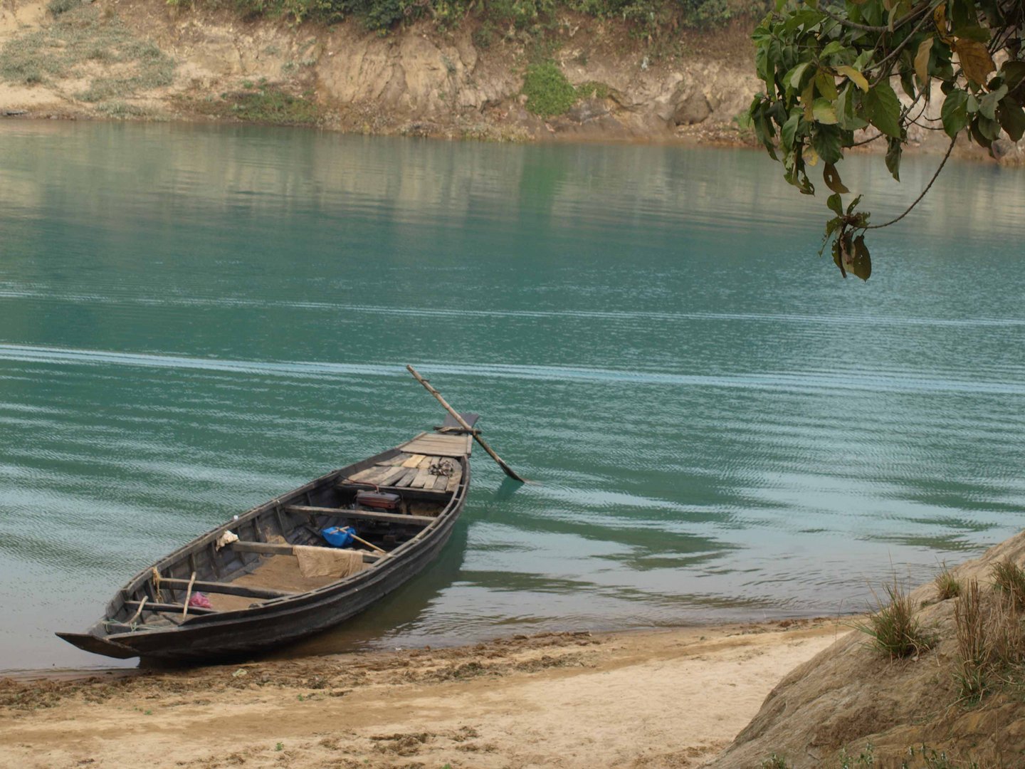 Country Boat in Blue Water River