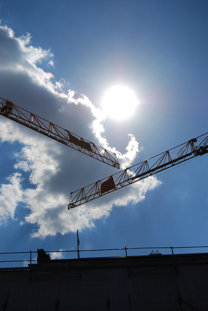 Crossing cranes in the sun