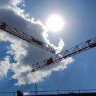 Crossing cranes in the sun