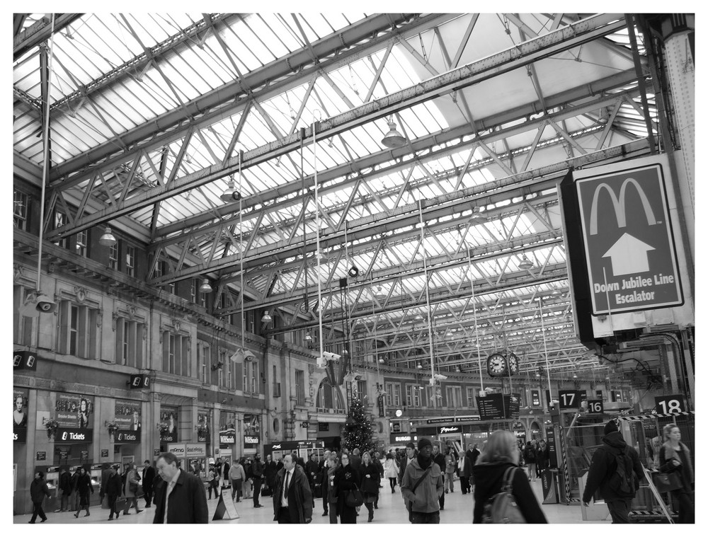 Crowds of people under the great roof of WATERLOO STATION
