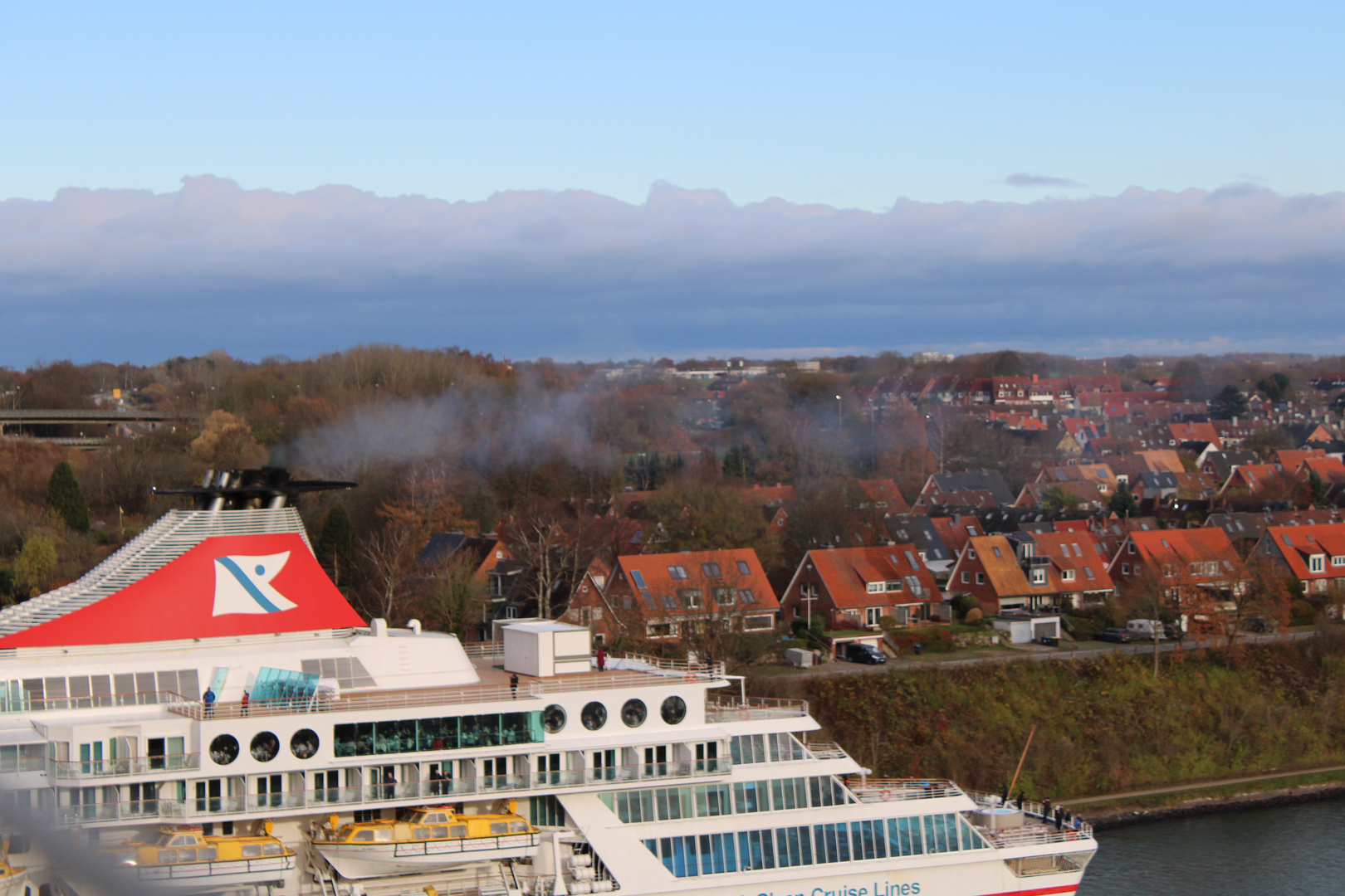 cruise city passing by, leaving a local city behind