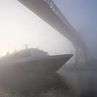 cruise ship at sunrise below railwaybridge Rendsburg