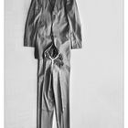 crumpled polyester suit without man