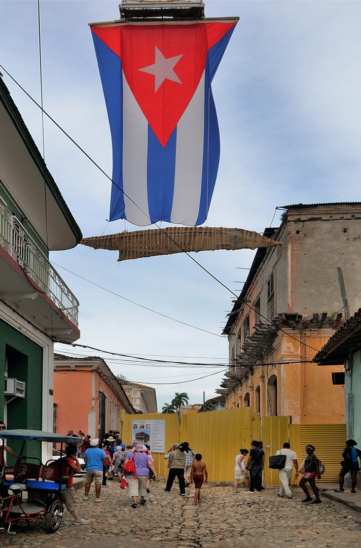 Cuba national flag over the alley in Trinidad