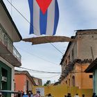 Cuba national flag over the alley in Trinidad