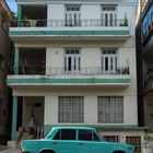 Cuban car in front of house