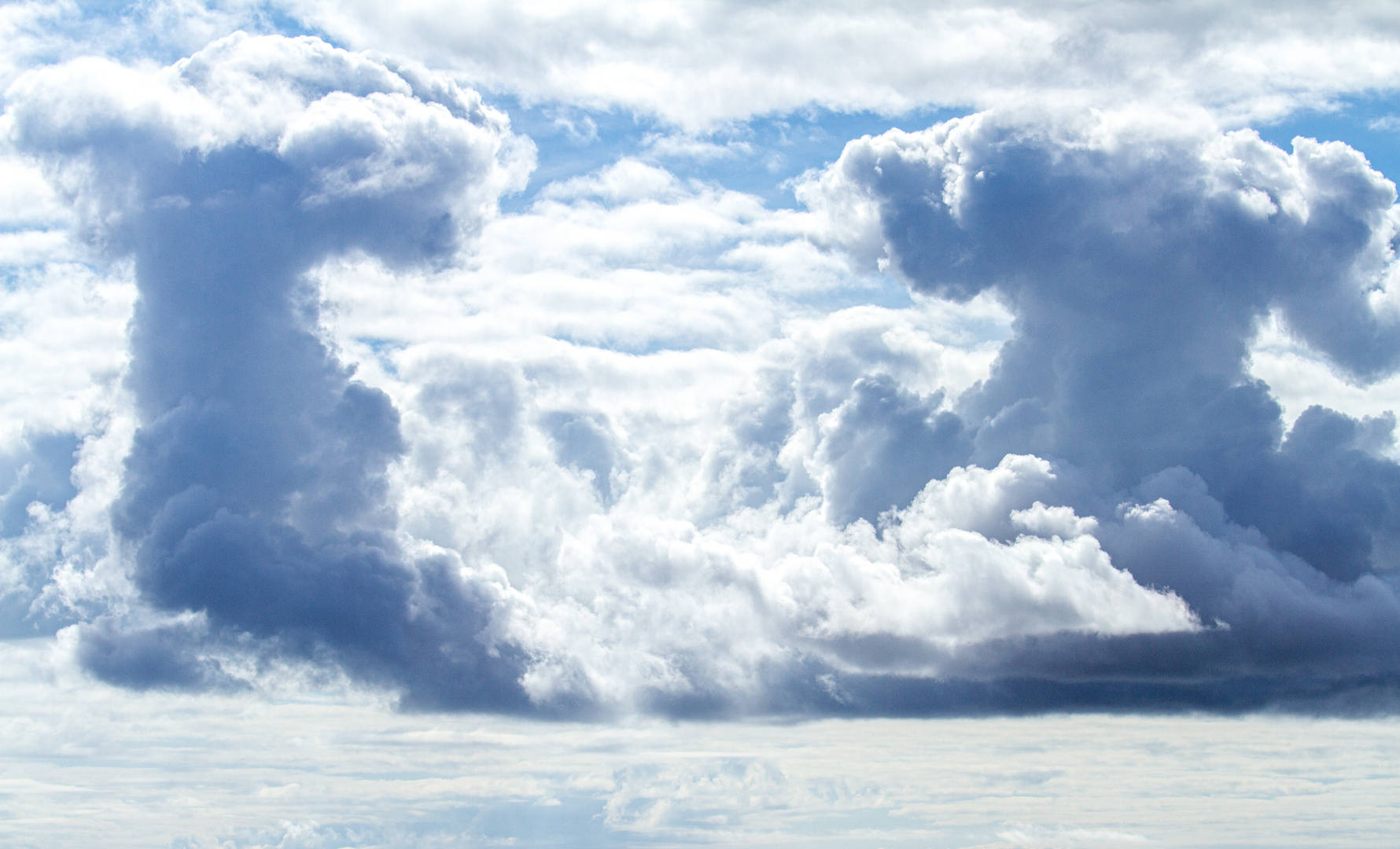 Cumulonimbus clouds tower over Dundee