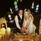 Cutting cake with romantic light.