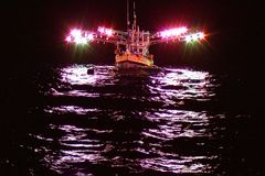 Cuttlefish fisherboat with its strong spotlights