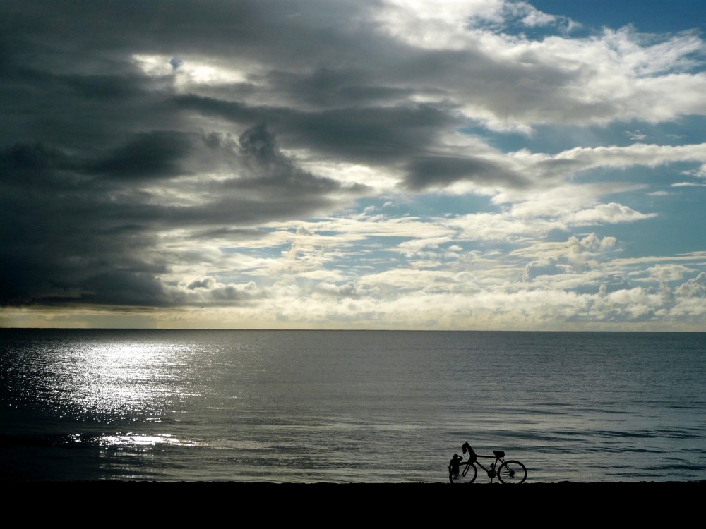 CYCLIST ON THE BEACH