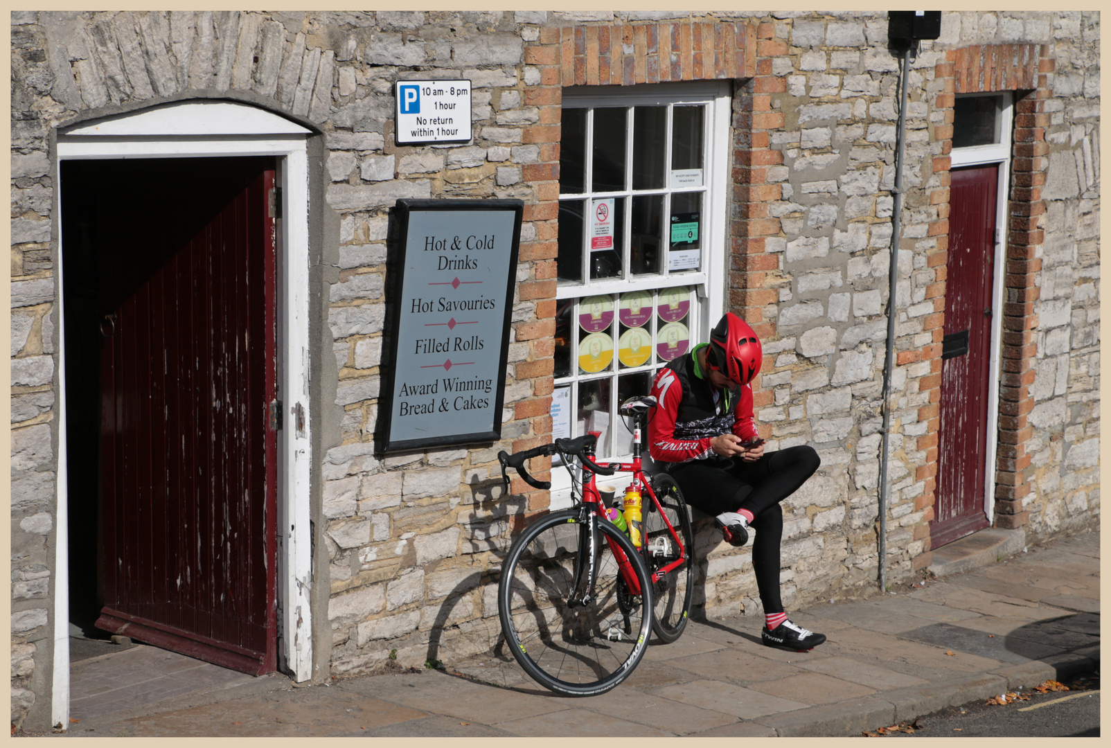 cyclist resting at corfe castle