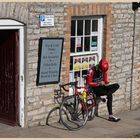 cyclist resting at corfe castle