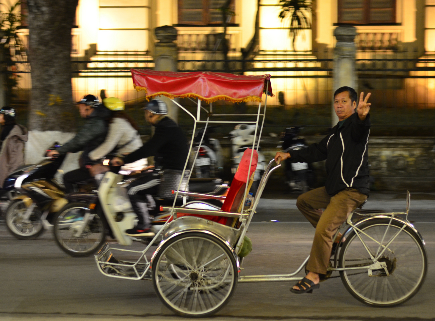 Cyclo taxi in the streets of Hanoi.