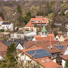 Dachlandschaft Neuffen mit Turmspitze der Ev. Martinskirche