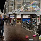 Damstraat Amsterdam. Milan(from Italy)is blowing bubbles