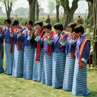 Dancing women in their traditional Kira costumes