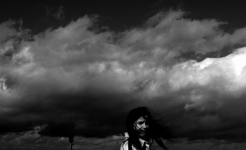 dark heavy clouds over her head