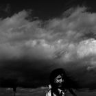 dark heavy clouds over her head