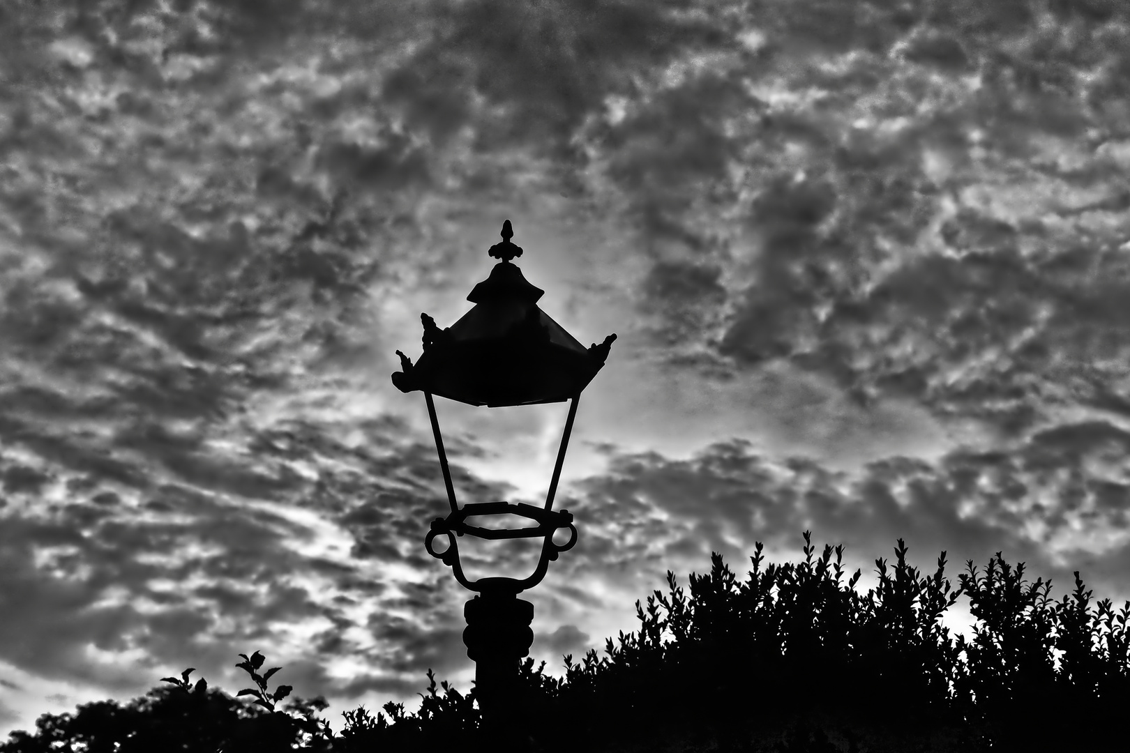 Defective old street lamp in evening mood