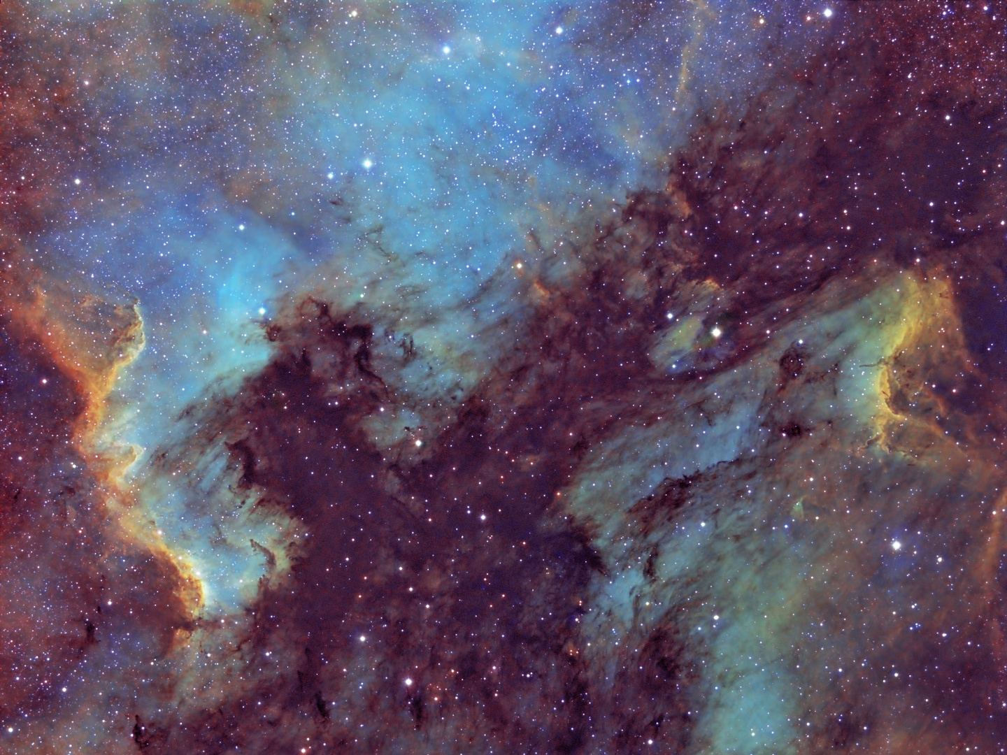 Der Nordamerika und Pelikannebel in der Hubble Palette