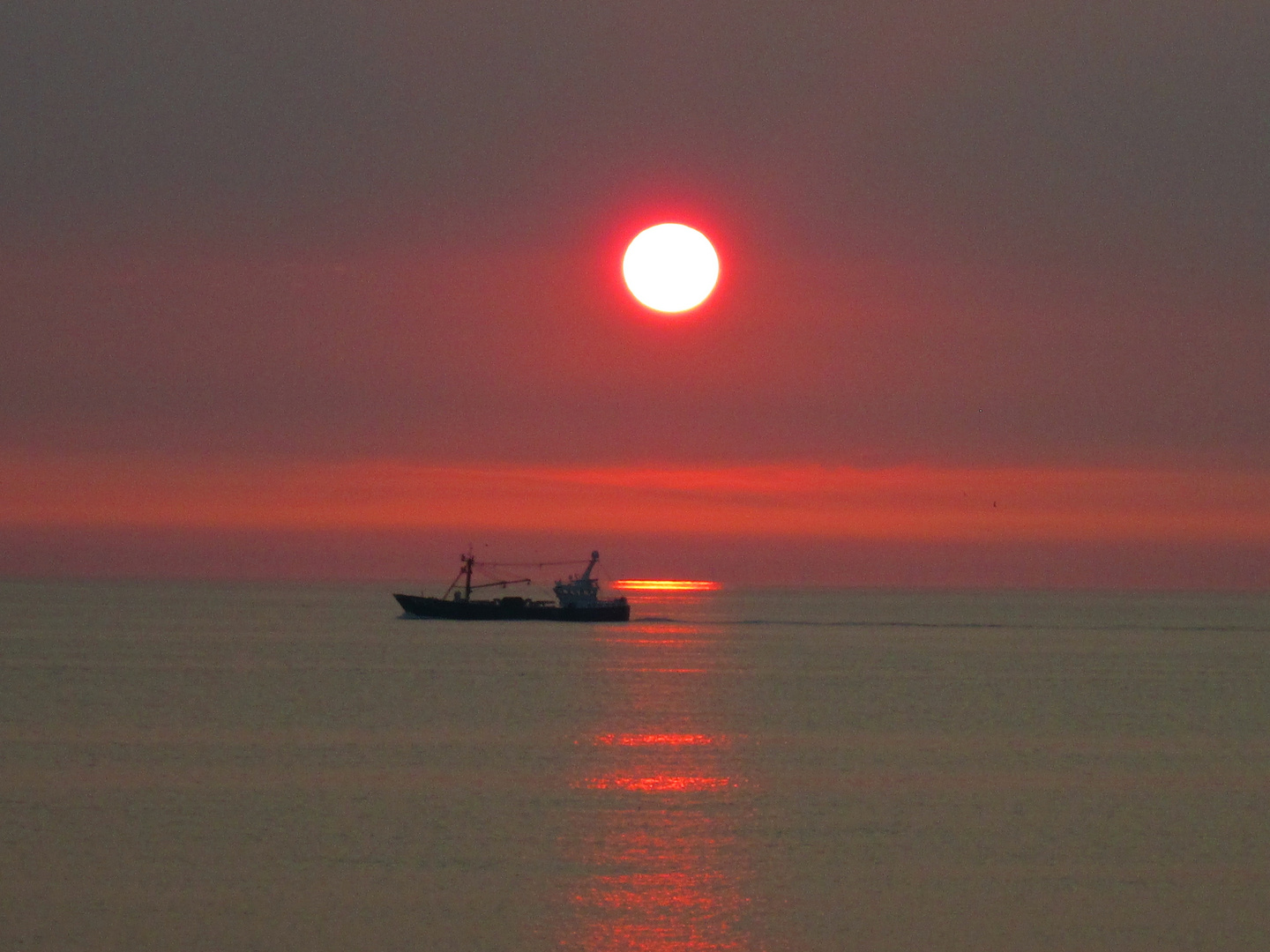 Der Sonnenuntergang über der Nordsee