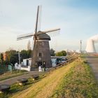 Doel-128-Embankment along Schelde River with Wind Mill and Cooling Towers of the Nuclear Power Plant