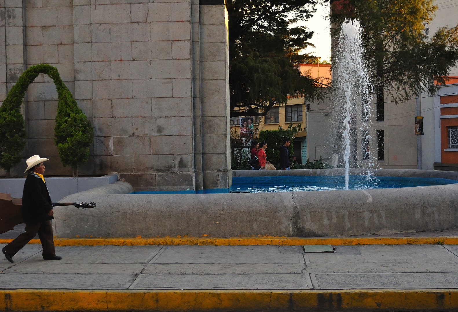 Double bass man and fountain