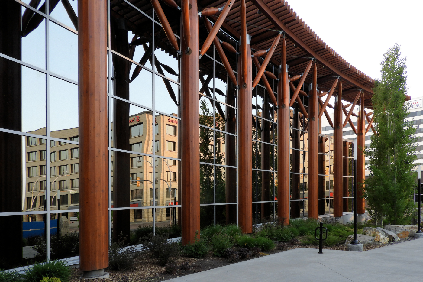 downtown reflected behind colonnade