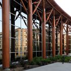 downtown reflected behind colonnade