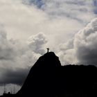 Dramatic clouds and paragliders over Christ the Redeemer in Rio